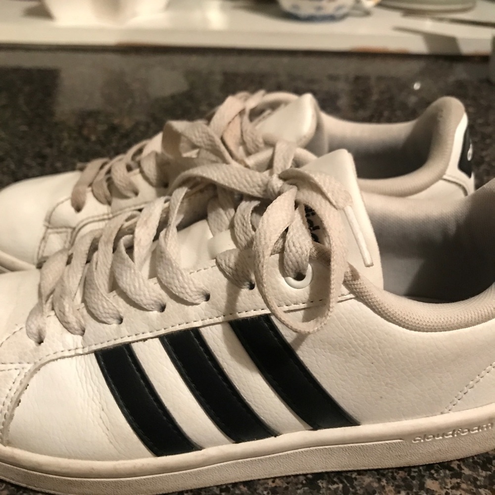 Black and white Adidas tennis shoes